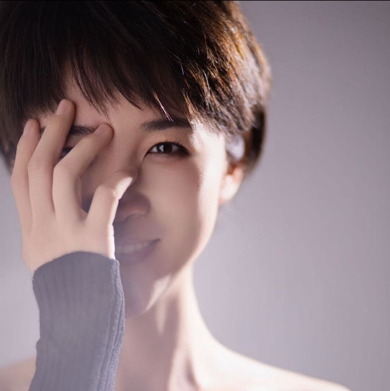 Healthy woman touching face